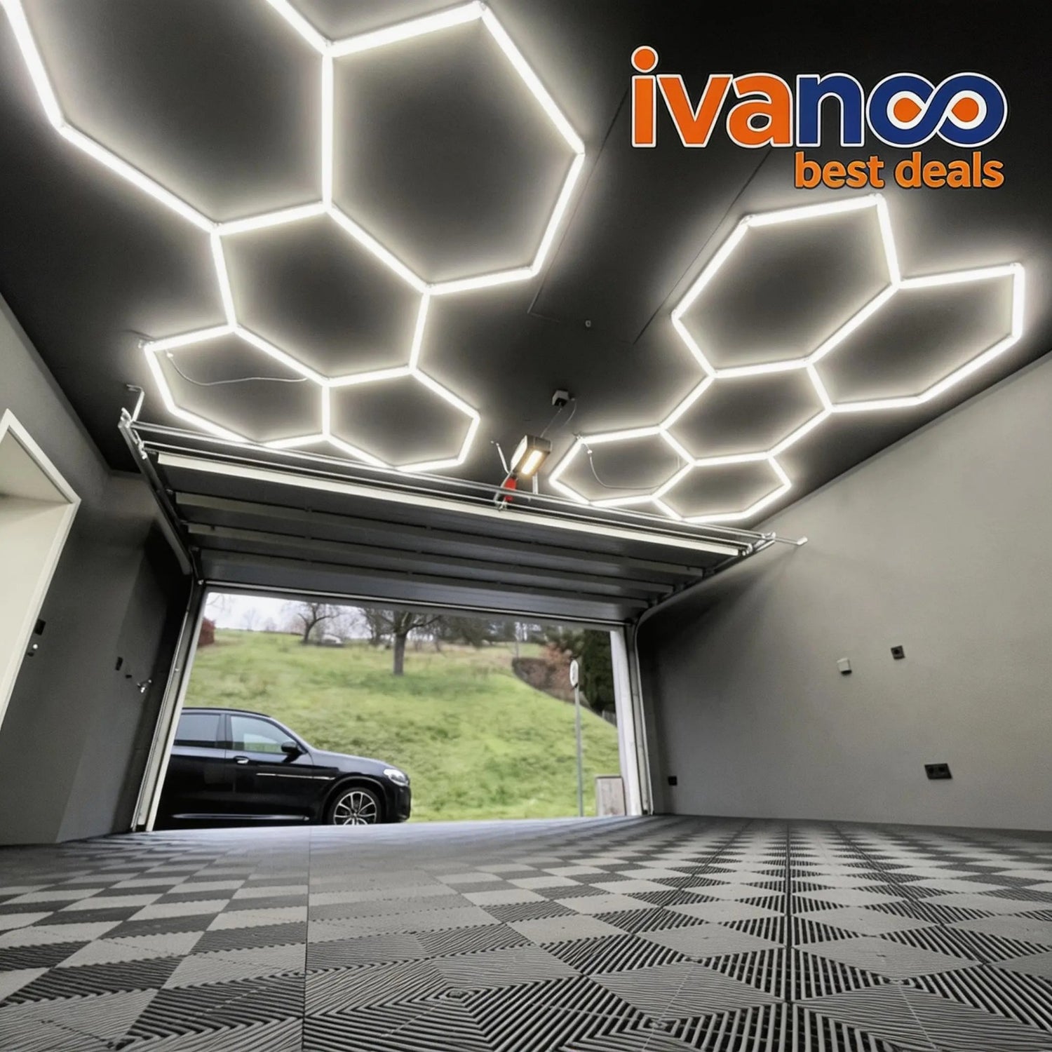 Modern garage with geometric ceiling lights and ivanco logo.