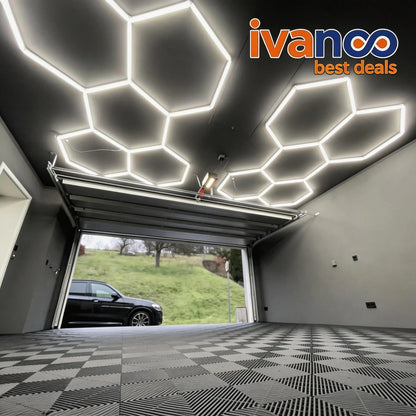 Modern garage with geometric ceiling lights and ivanco logo.